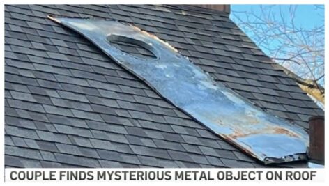 A metal object on top of a roof