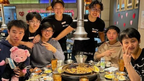 A group of individuals enjoying food at Mr. Pig, a new Korean BBQ spot in Philadelphia's Chinatown.