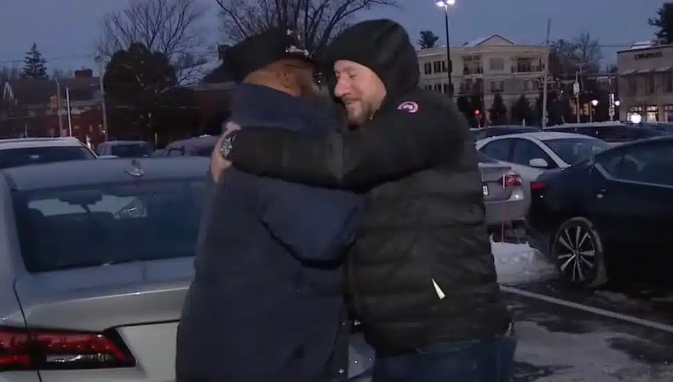 SEPTA conductor hugging passenger