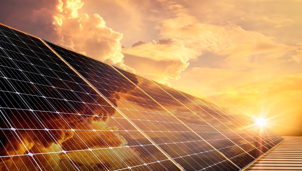 Solar panels reflect sparkling light and golden sky,Clean energy, and environment