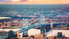 Aerial view of Ben Franklin bridge spanning Delaware river, in Philadelphia.