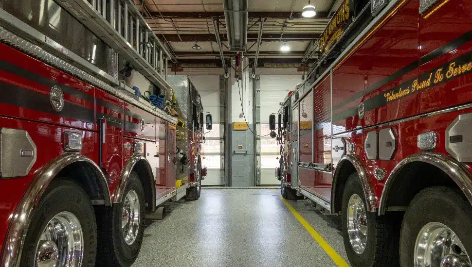 Firetrucks parked inside the local volunteer firehouse.