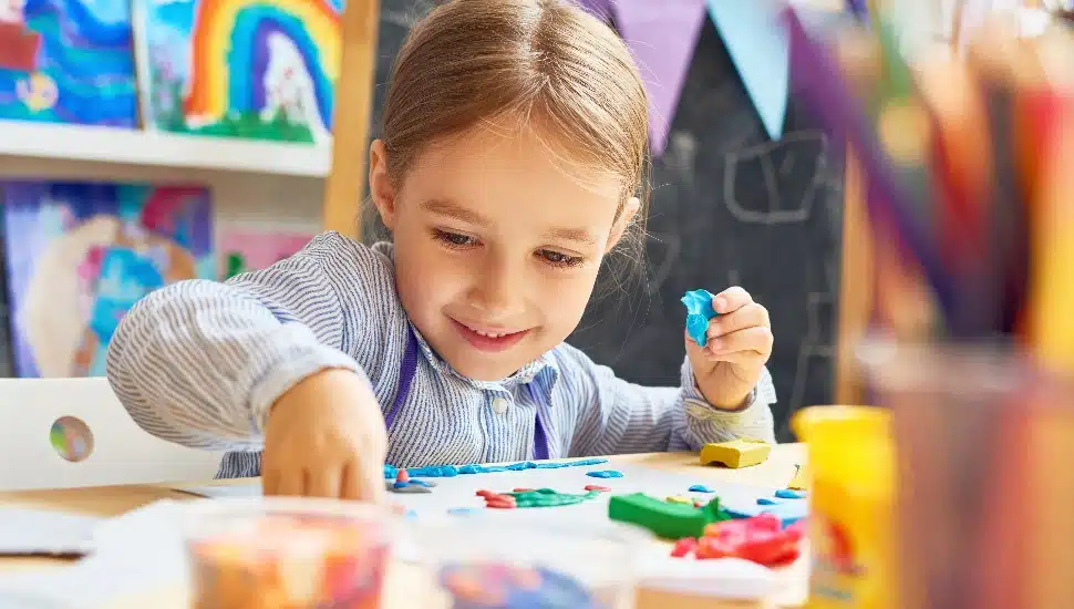Little girl working on crafts
