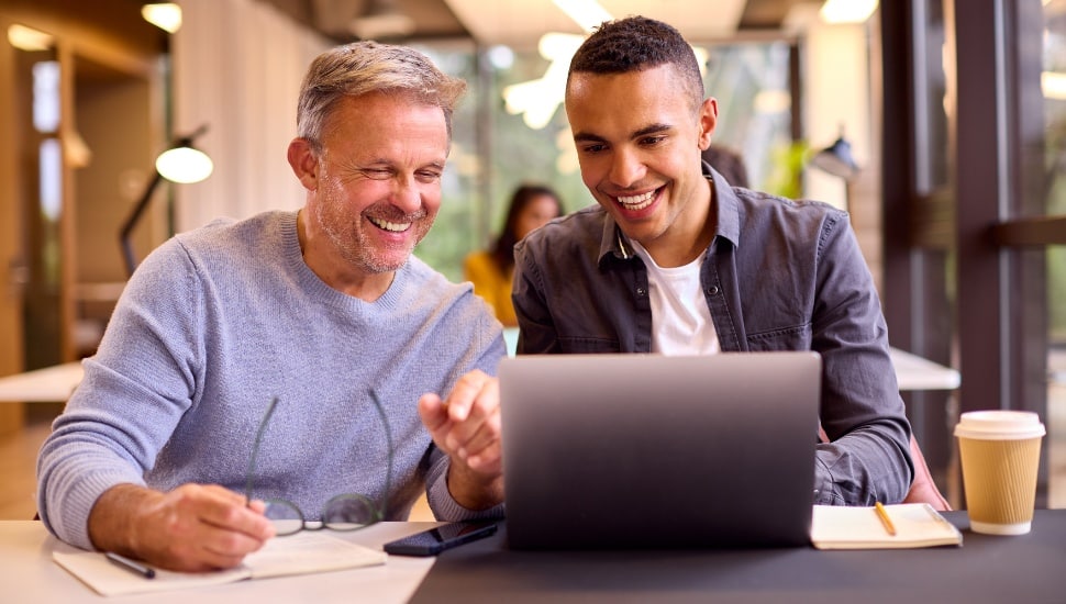 Mature Businessman Mentoring Younger Colleague