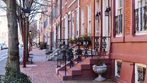 Rows of brownstone apartment buildings in Center City with windows, stoops and planters