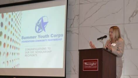 Foundations Community Partnership chair Tracy Pasternak Willis talks about a Summer Youths Corps program at a recent Foundations luncheon.