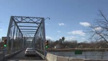 View of car driving onto Washington Crossing bridge