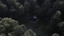 Aerial view of Croydon Woods and trees with building structure in the center