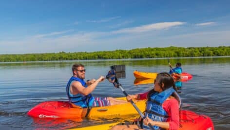 man and woman kayaking on lake Noxamixon