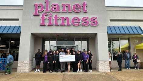 Exterior of Planet Fitness in Bristol with employees