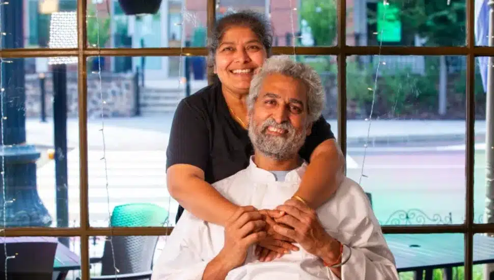 Guru's Indian Cuisine owners Ashni 'Baba' Kumar (center front) and Priya Guru (left, behind).