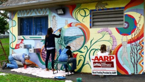 In 2018, as part of the AARP Community Challenge, Pennsylvania's Quarryville Borough made improvements (for both aesthetics and accessibility) to the playground in Huffnagle Park. Pictured are volunteers painting a mural.