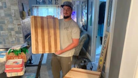 Ryan Prendergast with wooden cutting board