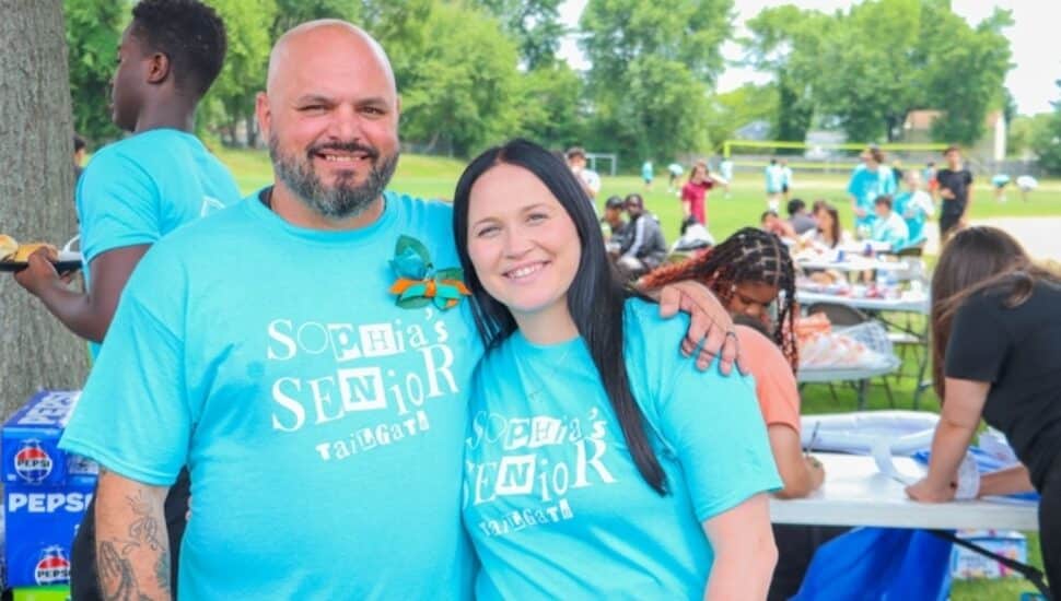 parents of Sophia wearing T-shirts that say Sophia's Senior Tailgate