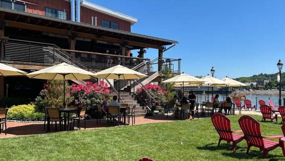 Stella outdoor seating umbrellas and Adironak chairs