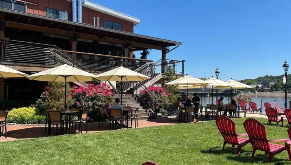 Stella outdoor seating umbrellas and Adironak chairs