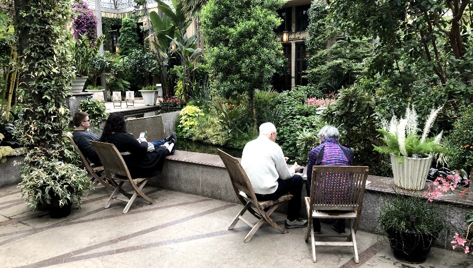 A senior couple relaxing in the Longwood Gardens Conservatory