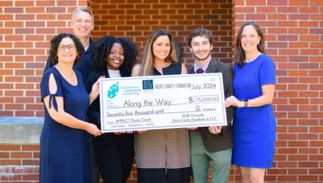 Members of the Along the Way team accept the $75,000 IMPACT Bucks Grant from a coalition of local funders. From left to right: Nicole Tell, BLBB Charitable’s Executive Director, Foundations Community Partnership CEO Tobi Bruhn, Along the Way’s Chief Operating Officer Shania Kelly, President & CEO Kristina Valdez, and Grant Writer Michael Vanelli, as well as Mandy Mundy, Bucks County Foundation’s Executive Director.