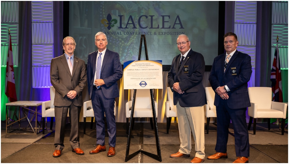 Security & Safety Executive Director Dennis McCauley, Bucks County Community College accepts the International Association of Campus Law Enforcement Administrators (IACLEA) Certificate of Accreditation from IACLEA President Paul Dean (second from right) and IACLEA Executive Director Paul Cell (first from right).