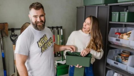 Jason and Kylie have a moment while organizing the clutter in their Haverford garage.