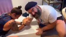 Jason Kelce arm wrestles USA women's rugby star Nicole Heavirland.