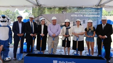 President Anne Prisco, Ph. D., along with trustees, alumni, and student-athletes at the groundbreaking for Holy Family University’s new athletic fieldhouse.