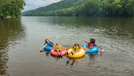 two people tubing on the river