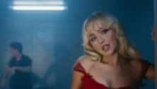 Sabrina Carpenter wearing red dress in Please Please Please music video