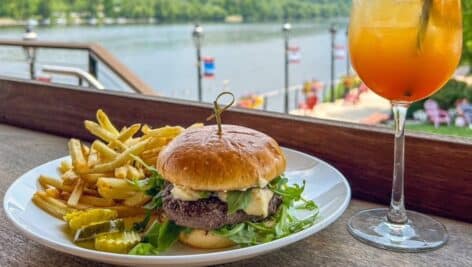 burger and fries on plate with drink in front of Delaware River