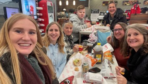 Customers and staff gather inside a Wawa store.