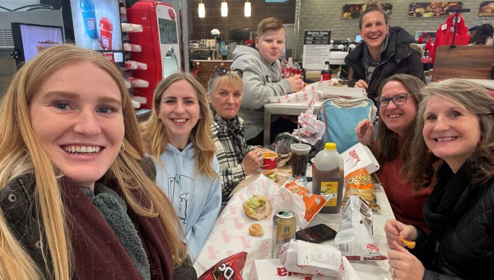Customers and staff gather inside a Wawa store.