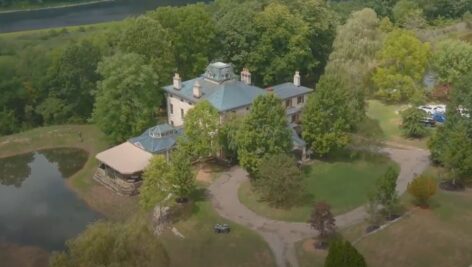 large home surrounded by trees