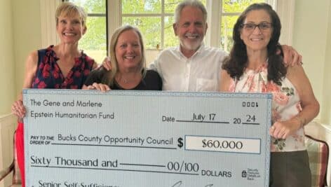 From left Julie Dees of Family Service Association, Erin Lukoss of Bucks County Opportunity Council Gene Epstein, and Cheryl Campbell of The Christmas Gala