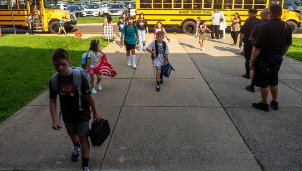 Students head toward the school from their busses for their first day of the 2024-2025 school year at Cornwells Elementary School in Bensalem.