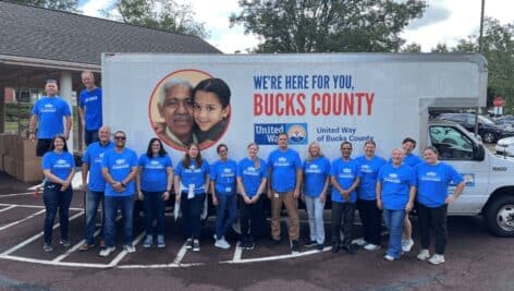 Volunteers gather along United Way of Bucks County Truck.