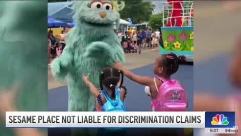 Rosita ignoring two young Black girls at Sesame Place.