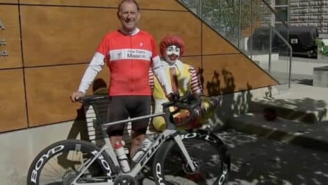 Jeff Bekos posing in front of Ronald McDonald House.