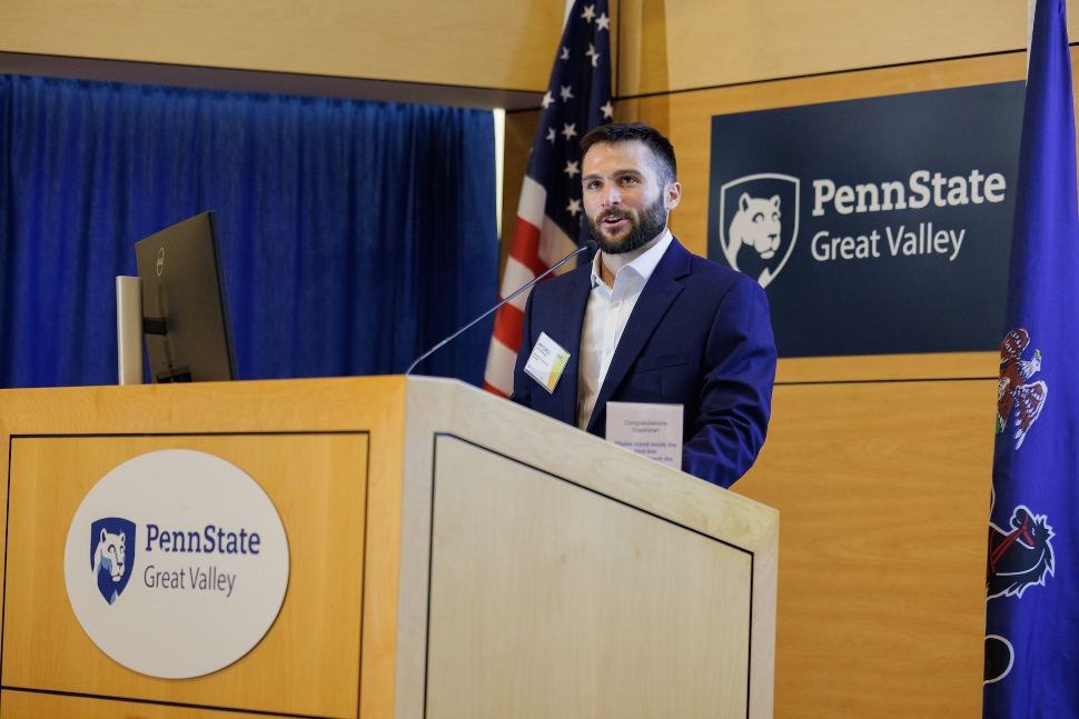 Mitchell Phillips introducing a speaker at VMS at Penn State Great Valley.
