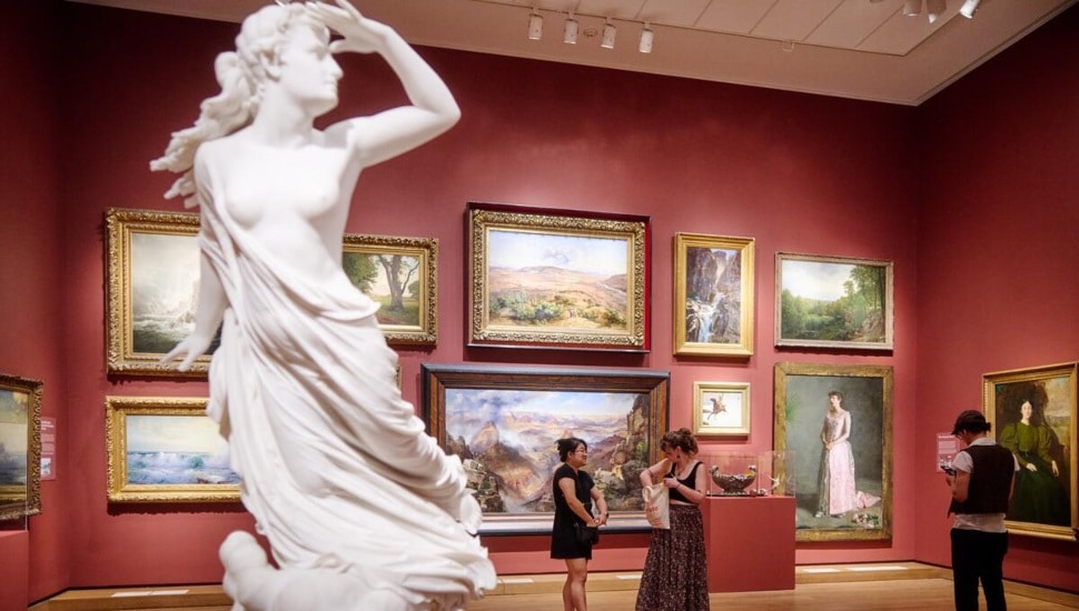 People enjoying exhibits inside Philadelphia Museum of Art.