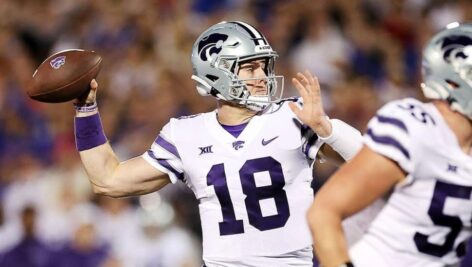 Will Howard holding football