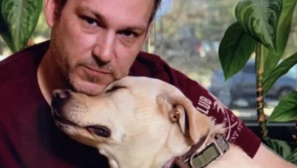 A veteran with his service dog.