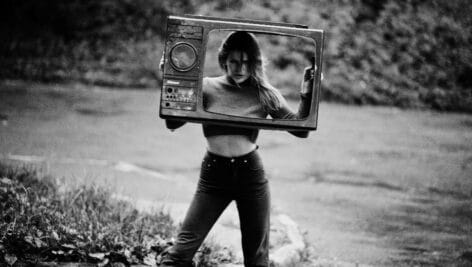 Attractive model with old tv box.