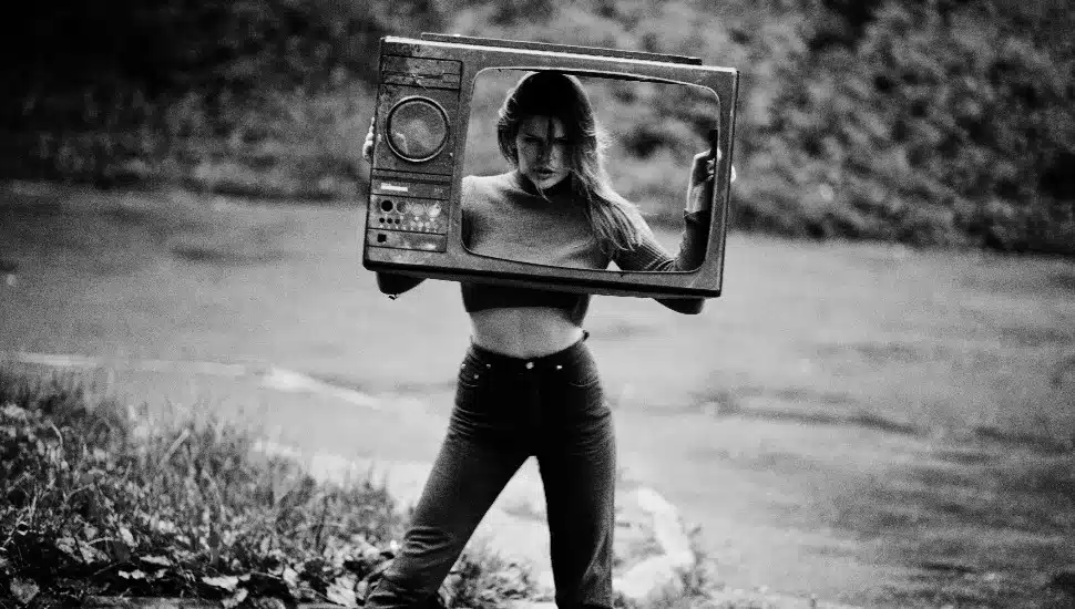 Attractive model with old tv box.