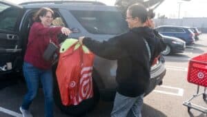 Christina Rago, from Morrisville, left, takes a bag full of goods from Angela Lancos, from New Jersey.