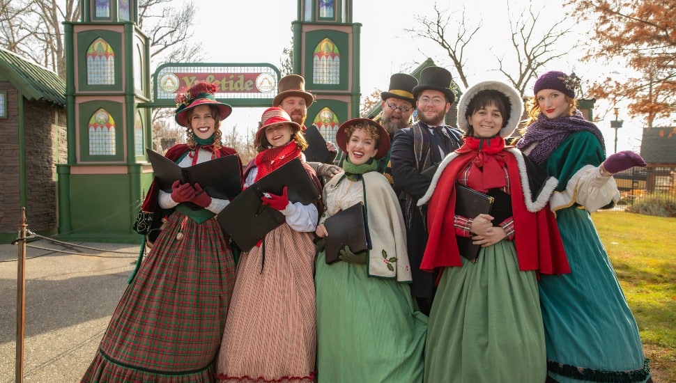 Carolers gathered together at Yuletide at the Faire.