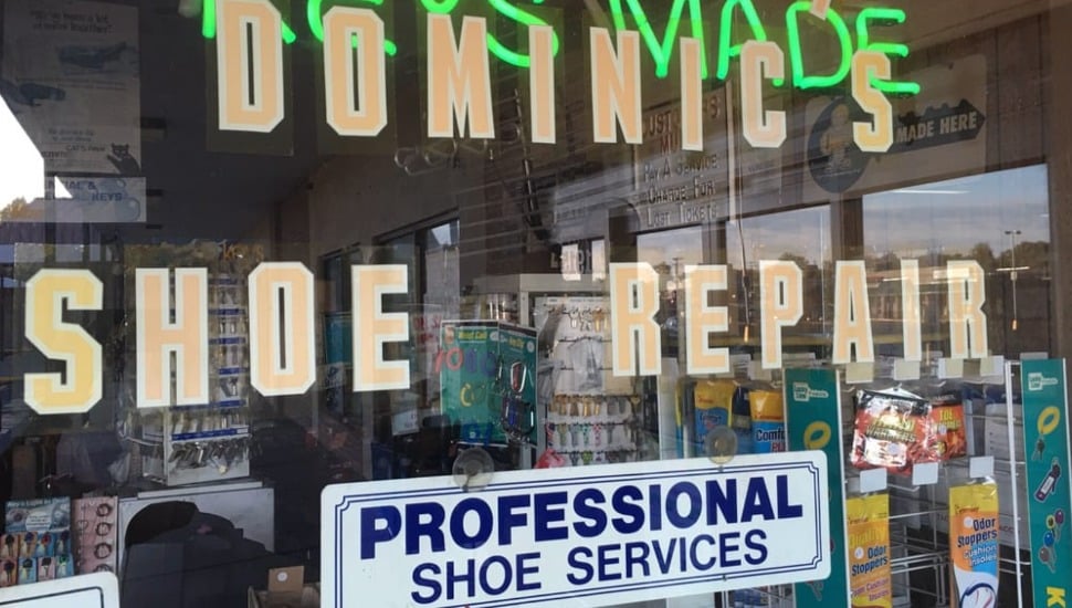 The front window of Dominic's Shoe Repair.