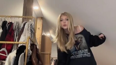 Loren Gray ducks through her low-ceiling attic.