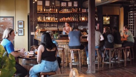 People inside the recently-shuttered New Liberty Distillery.