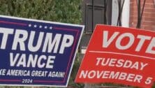 Trump Vance lawn sign next to a 'Vote Tuesday' sign.