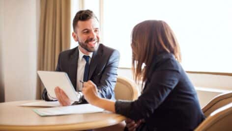 A business owner discussing loan options with a banker.